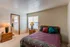 Furnished model bedroom with queen bed at Hickory Forest in Memphis, TN