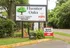 Leasing sign with a deposit special near the entrance at Hunter Oaks Apartments in Memphis, TN