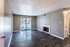 Living room with a fireplace and patio door at Hunter Oaks Apartments in Memphis, TN