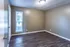 Bedroom with wood-style floors and gray walls at Hunter Oaks Apartments in Memphis, TN