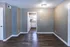 Hallway view toward the kitchen with wood-style floors at Hunter Oaks Apartments in Memphis, TN