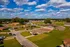 Aerial view of brick homes and open green space at Jackson Heights Residential in West Memphis, AR
