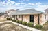 Brick duplex with a covered front walkway at Jackson Heights Residential in West Memphis, AR