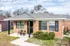 Brick ranch home with a small front patio at Jackson Heights Residential in West Memphis, AR