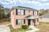 Brick townhouse with a covered front entry at Jackson Heights Residential in West Memphis, AR