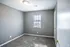 Second bedroom with gray walls and carpet at Jackson Heights Residential in West Memphis, AR