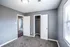 Bedroom with two closets and carpet at Jackson Heights Residential in West Memphis, AR