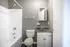 Bathroom with a tub-shower and white vanity at Jackson Heights Residential in West Memphis, AR