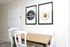 Dining nook with a white table and framed wall art at Linden Colonial in Holladay, UT