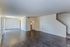 Open living area with wood-style floors and stairs at Shadowbrook Townhomes in Memphis, TN