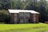 Brick apartment building with spacious front lawn at Meadow Creek Apartments in Jackson, MS
