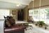 Clubhouse lounge with leather sofa at Meadow Creek Apartments in Jackson, MS
