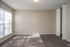 Primary bedroom with carpet in townhome at Meadow Creek Apartments in Jackson, MS