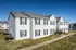 Two-story apartment buildings with sidewalks at Meadows West Memphis Apartments in West Memphis, AR