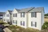 Side view of apartment buildings and lawn at Meadows West Memphis Apartments in West Memphis, AR