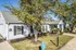 Landscaped grounds with shade tree and mailbox area at Meadows West Memphis Apartments in West Memphis, AR