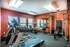 Fitness center with cardio and weight equipment at Meadows West Memphis Apartments in West Memphis, AR