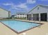 Pool deck with covered pavilion at Meadows West Memphis Apartments in West Memphis, AR