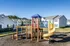 Playground with slides for kids at Meadows West Memphis Apartments in West Memphis, AR
