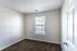Bedroom with window and plank flooring at Meadows West Memphis Apartments in West Memphis, AR