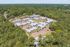 High aerial overview of the wooded community at Pines Apartments in Jackson, MS