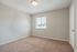 Second bedroom with carpet and natural light at Pines Apartments in Jackson, MS