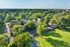 Aerial view of tree-lined streets and green space at Shadowbrook Townhomes in Memphis, TN