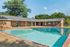 Sparkling outdoor pool with sunny deck at Shadowbrook Townhomes in Memphis, TN