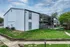 White and gray building with private balconies at Trails at Northpointe in Jackson, MS