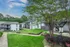 Shady courtyard with trees and flowering shrubs at Trails at Northpointe in Jackson, MS