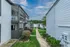 Covered stairways beside landscaped walkways at Trails at Northpointe in Jackson, MS