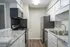 Kitchen with granite counters and stainless appliances in a 2 bedroom apartment at Trails at Northpointe in Jackson, MS
