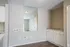 Dining area with built-in cabinets and wall mirror at Trails at Northpointe in Jackson, MS
