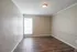 Primary bedroom with wood-style floors and window at Trails at Northpointe in Jackson, MS