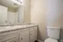 Second bathroom with granite double-sink vanity at Trails at Northpointe in Jackson, MS