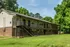 Two-story building with exterior stairs and green lawn at Windsor Place Apartments in Memphis, TN