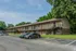 Apartment buildings along a paved parking lot at Windsor Place Apartments in Memphis, TN