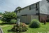 Courtyard landscaping with shrubs and flowers at Windsor Place Apartments in Memphis, TN
