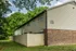 Side view of a building with fenced patios at Windsor Place Apartments in Memphis, TN