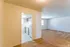 Open living room with view into the kitchen at Windsor Place Apartments in Memphis, TN