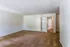 Spacious living room with carpet and doorway at Windsor Place Apartments in Memphis, TN