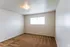 Carpeted bedroom with a wide window at Windsor Place Apartments in Memphis, TN
