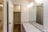 Dressing area with vanity and walk-in closet at Windsor Place Apartments in Memphis, TN