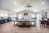 Clubhouse lounge with seating and vaulted ceiling at The Meadows Apartments in Memphis, TN
