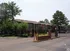 Gated entrance with brick pillars and pine trees at Hickory Pointe in Memphis, TN