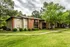 Courtyard lawn with brick buildings and mature trees at Hickory Pointe in Memphis, TN