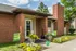 Brick unit entry with flowers and a chimney at Hickory Pointe in Memphis, TN