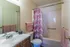 Primary bathroom with a pink shower curtain at Hickory Pointe in Memphis, TN