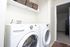 In-unit laundry with a front-load washer and dryer at Braewood in Murray, UT