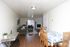 Open living and dining area with wood-style floors at Braewood in Murray, UT